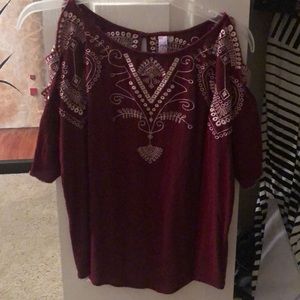 Maroon colored blouse.